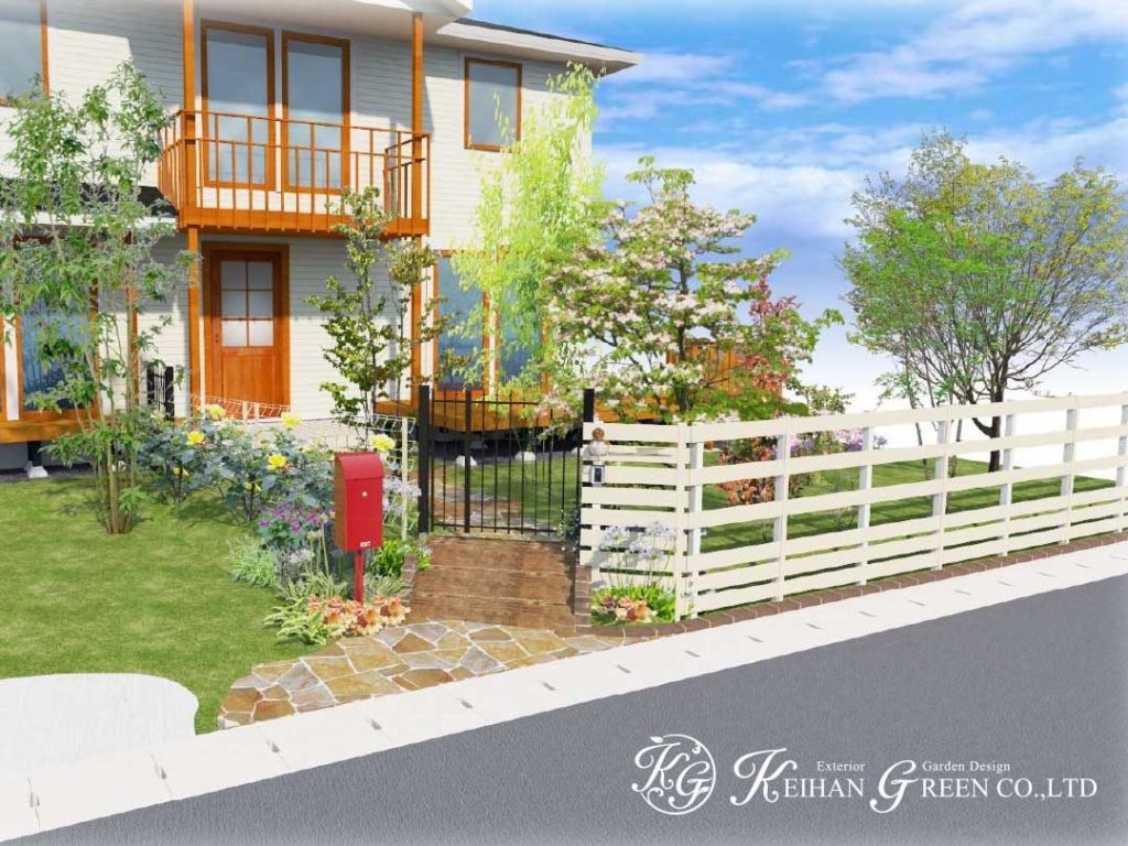 白いフェンスと赤いポストが大人かわいいエントランス