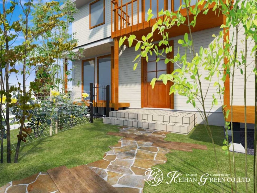 白いフェンスと赤いポストが大人かわいいエントランス